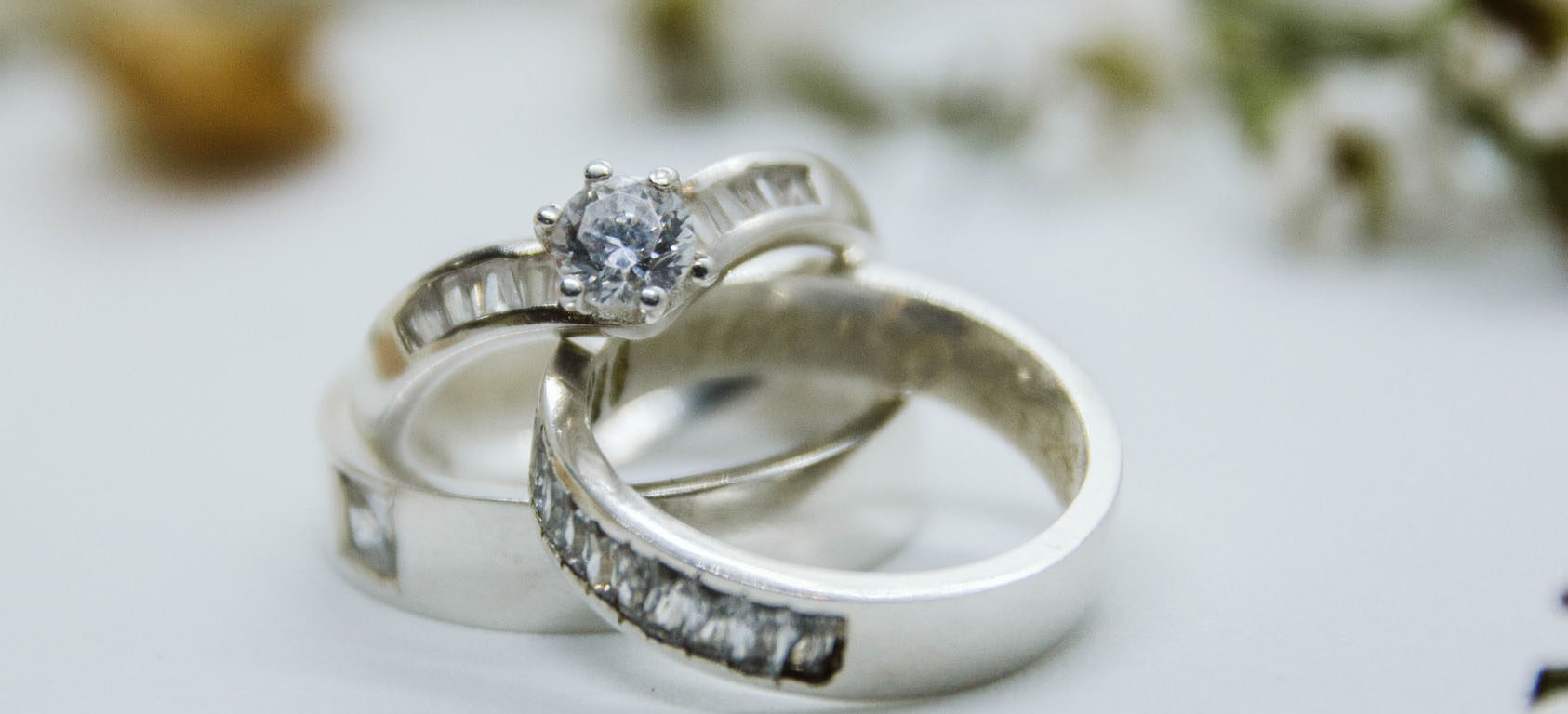sterling silver bridal rings on white table