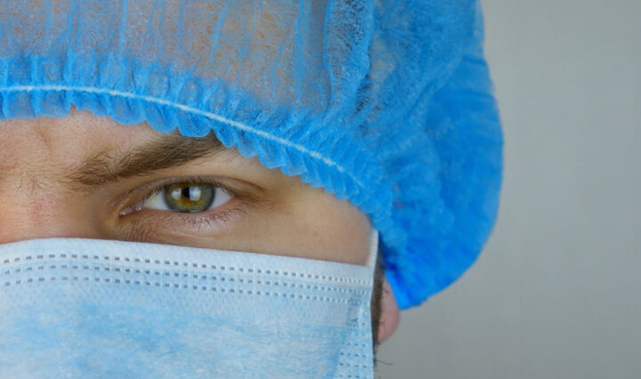 close up shot of medical worker's face wearing ppe
